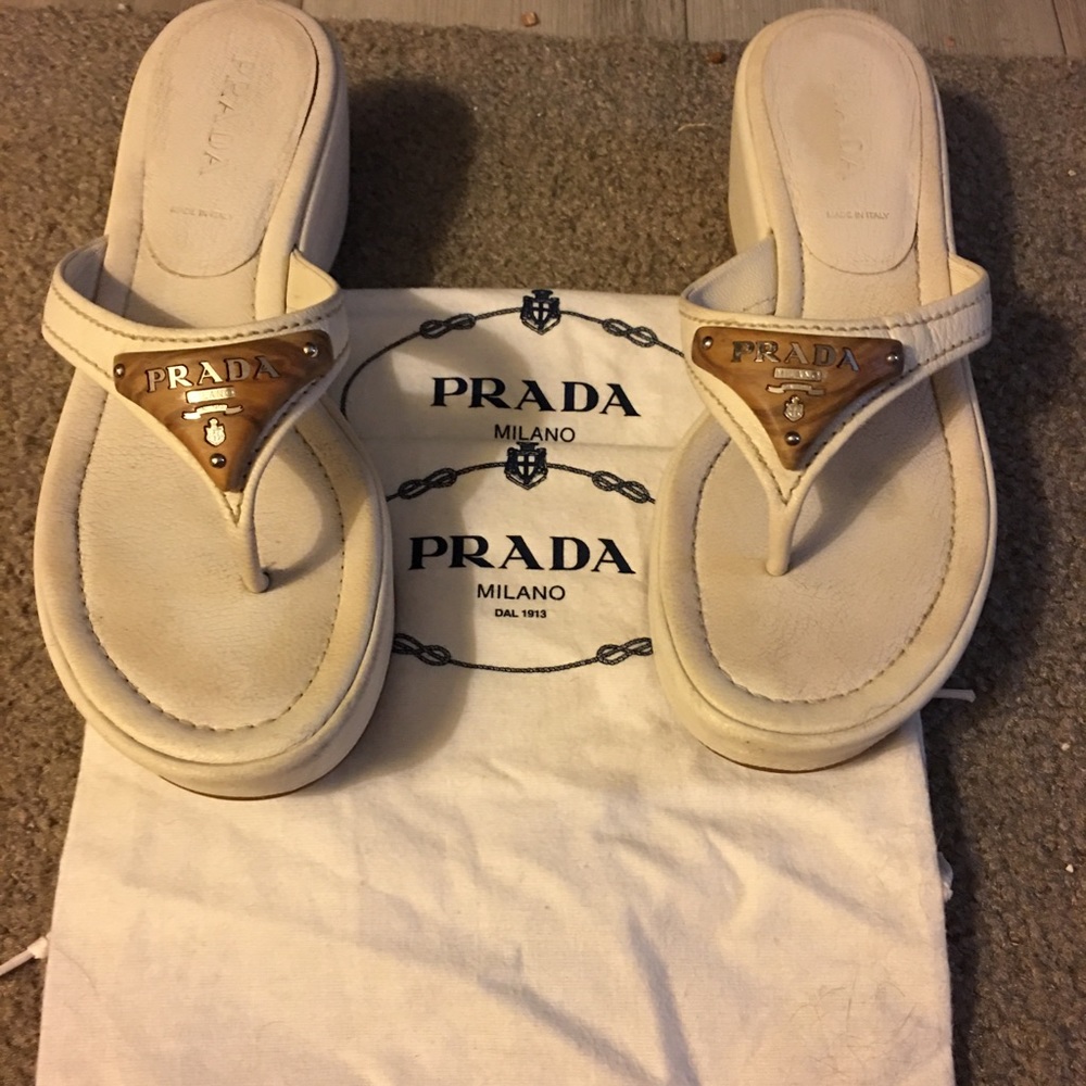 Prada white wedge sandals with wooden emblem. Ladies size 7.